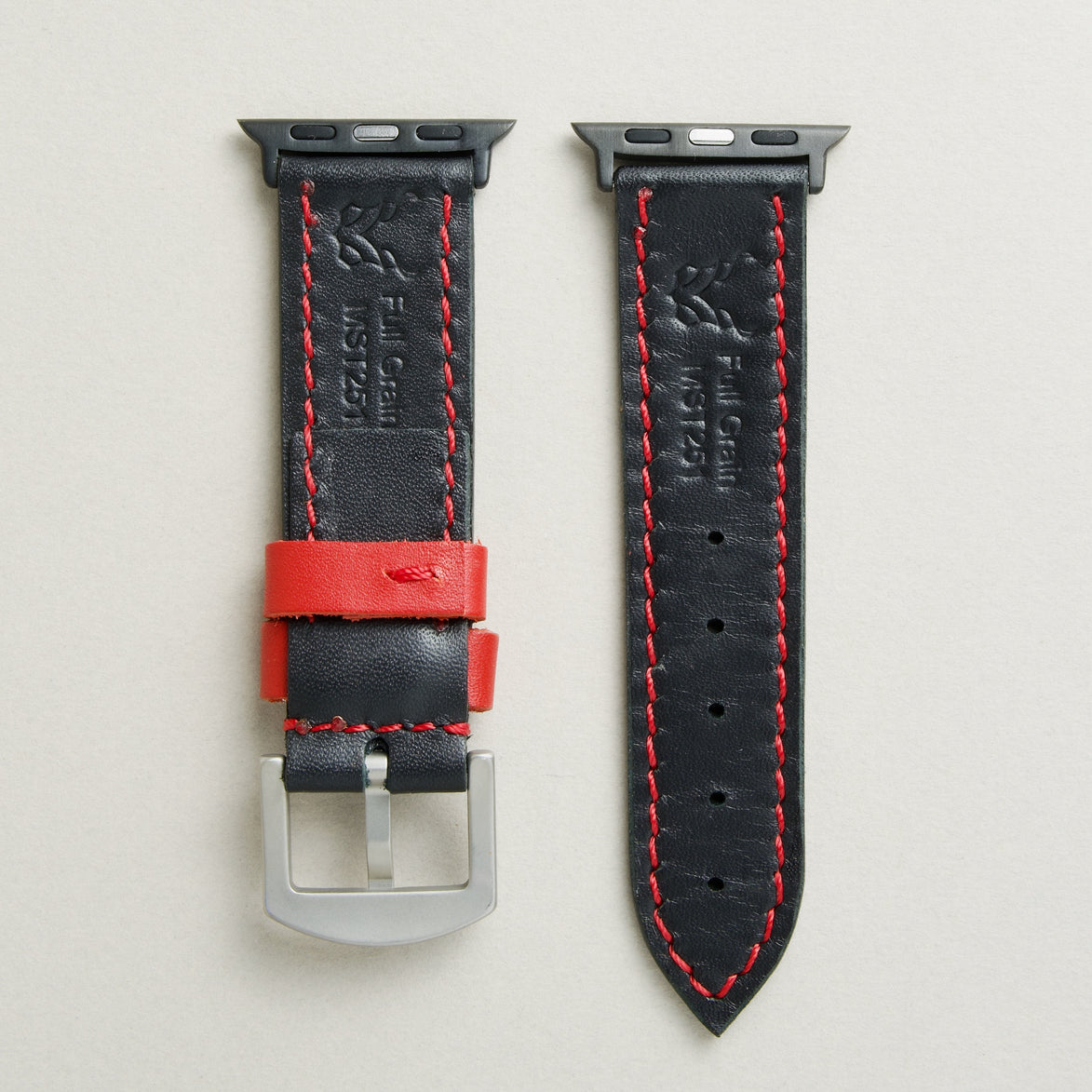 Back view of Midnight Black leather strap with black stainless steel adapters and silver buckle, showing red stitching and matching loops, embossed logo, and serial number. Markore Hour Line.