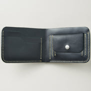 Interior view of obsidian black full-grain leather bifold wallet featuring ivory handmade stitching, card slots and coin pocket with stainless steel press stud. Markore Indus Sultan