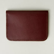 Back view of espresso full-grain leather wallet featuring handmade stitching. Markore Ravi Slip.