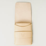 Front view of natural full-grain leather flap wallet featuring a flap holder with embossed logo, and handmade stitching. Markore Sutlej Vault.