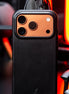 real life image of markore shell frame case on orange iphone 17 pro