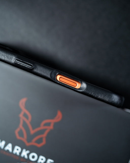Close-up of Markore Shell Guard iPhone 7 phone case with a brand logo on a dark background